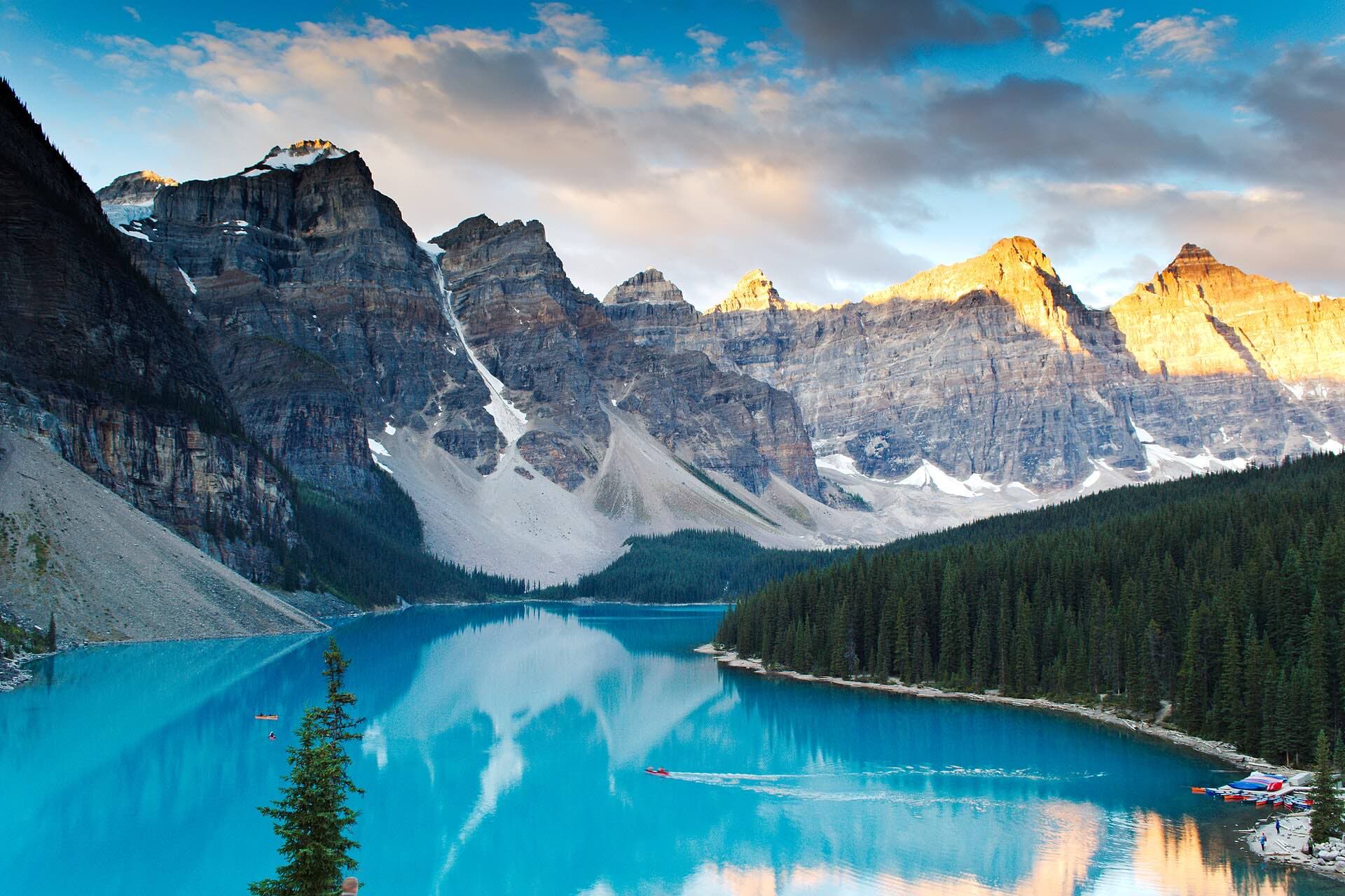 Sunrise alpenglow on the Valley of the Ten Peaks above the turquoise water of Moraine Lake, Banff National Park, Alberta